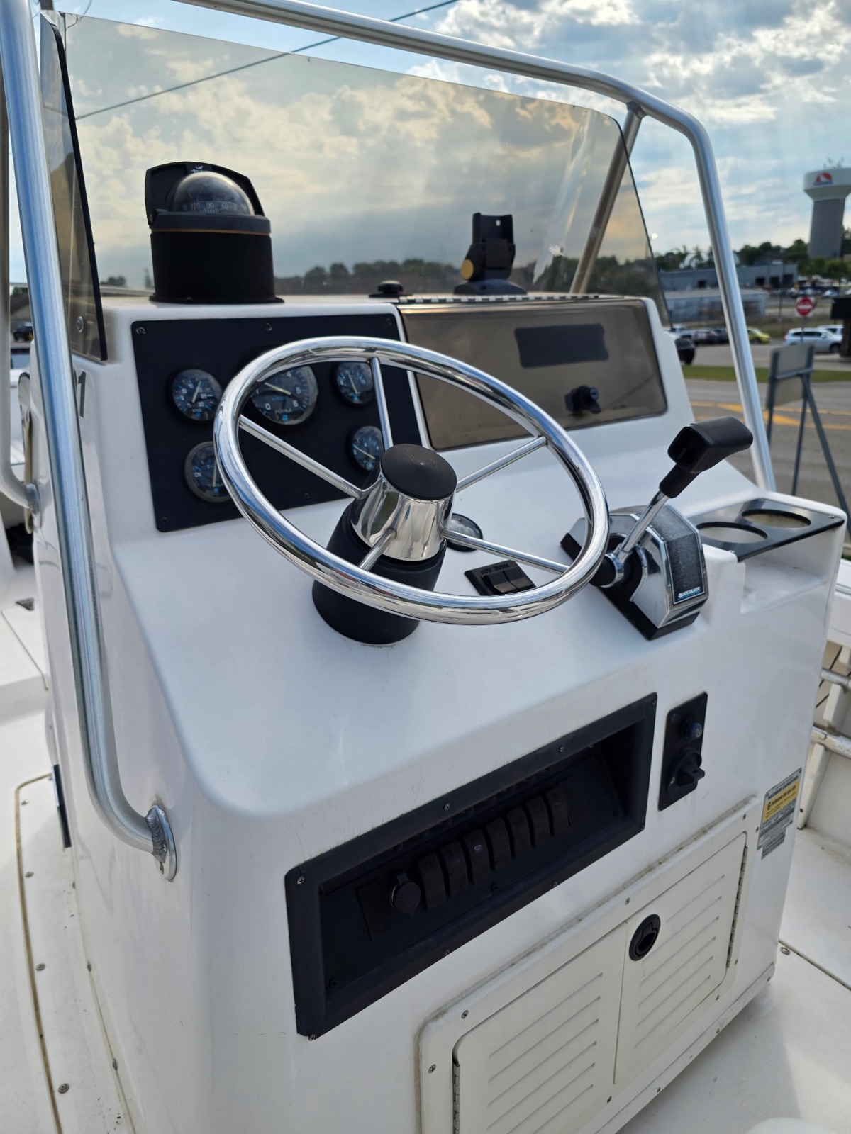 Helm with stainless wheel, gauges, compass and Quicksilver control
