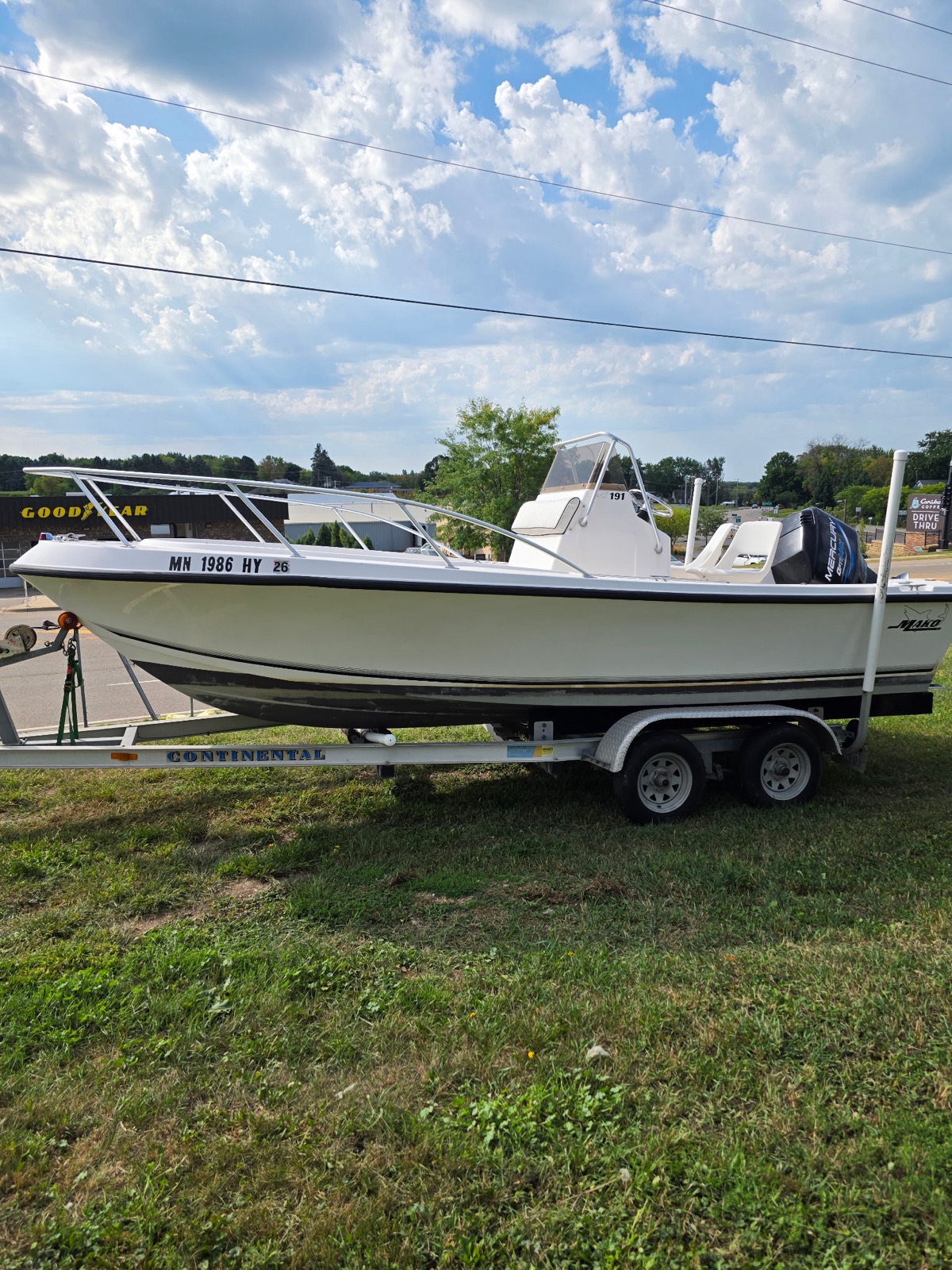 1998 Mako 191 center console on a Continental tandem-axle trailer, starboard side